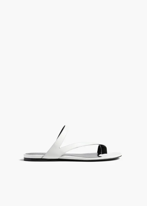 Aimee Flat Sandal in Optic White Leather sold by KHAITE