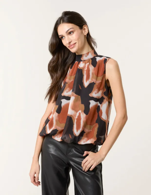 Printed Sleeveless Puff Hem Blouse sold by Blue Vanilla
