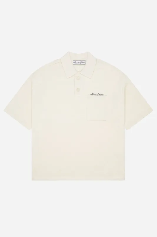 pique knitted polo ecru/black sold by about:blank
